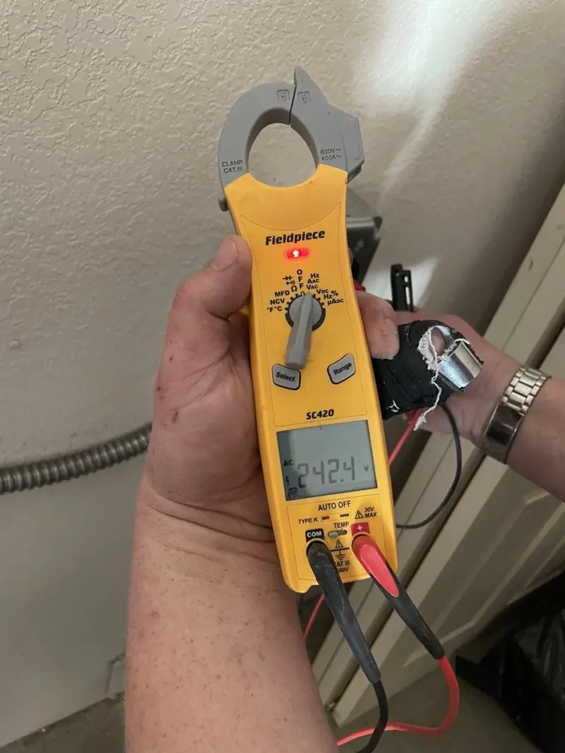 Voltage testing with clamp meter during Generator Installation in Chevy Chase